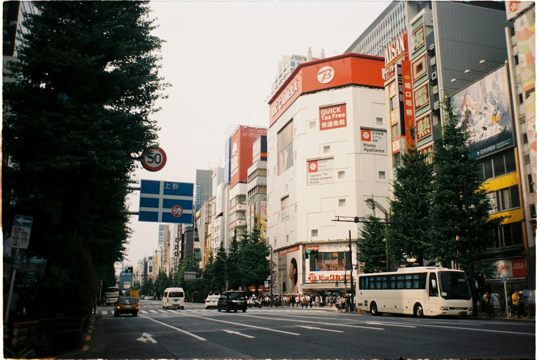a city street filled with traffic and tall buildings