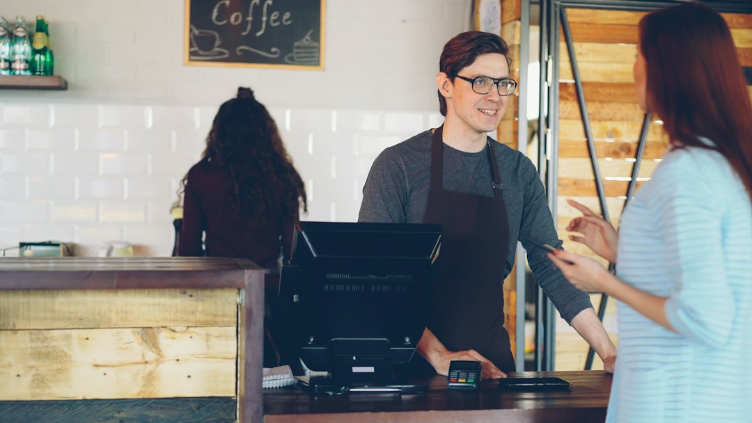 Customer pays at a coffee shop