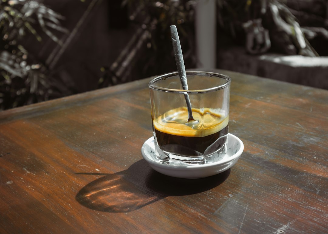 a glass with a drink in it