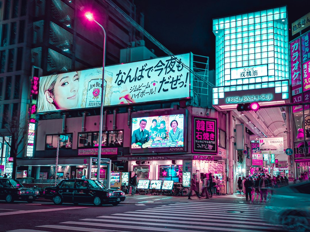 cars parked in front of store during night time