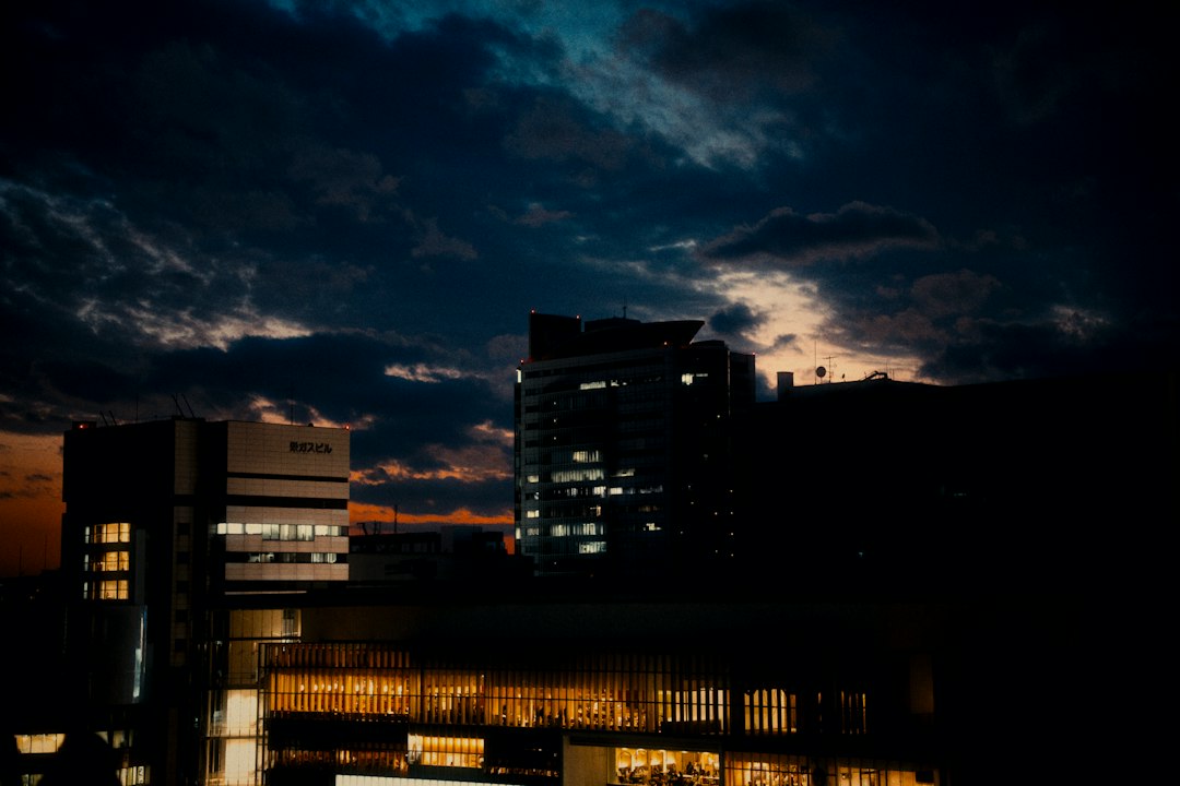City skyline with illuminated buildings at dusk