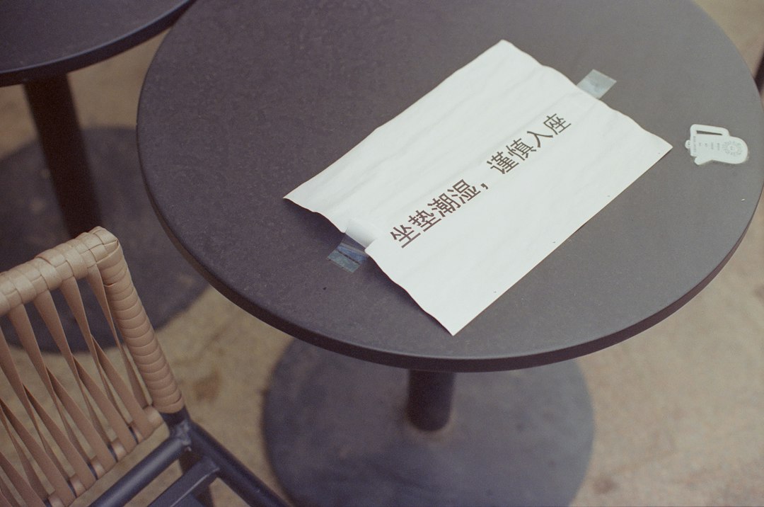 Sign on a table in a cafe